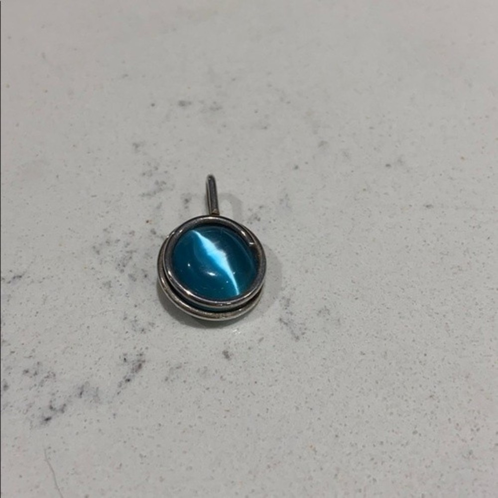 .925 stamped silver pendant with dark blue stone